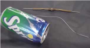 A can, wire and a compass to pierce the can with.