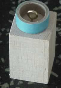 The nose cone balsa wood block with flush mount ring attached.